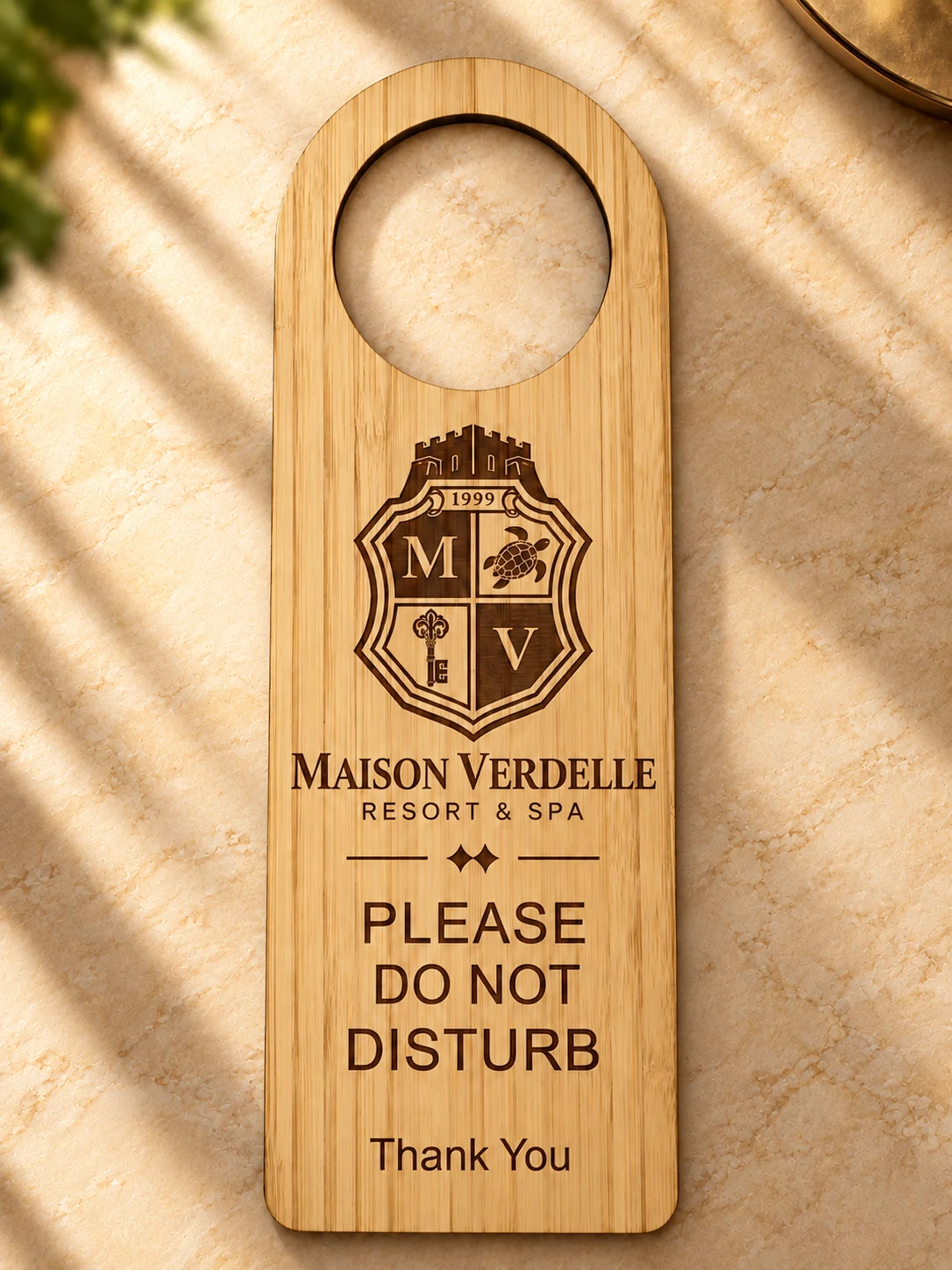 Bamboo Do Not Disturb door hanger laser-engraved with the Maison Verdelle logo