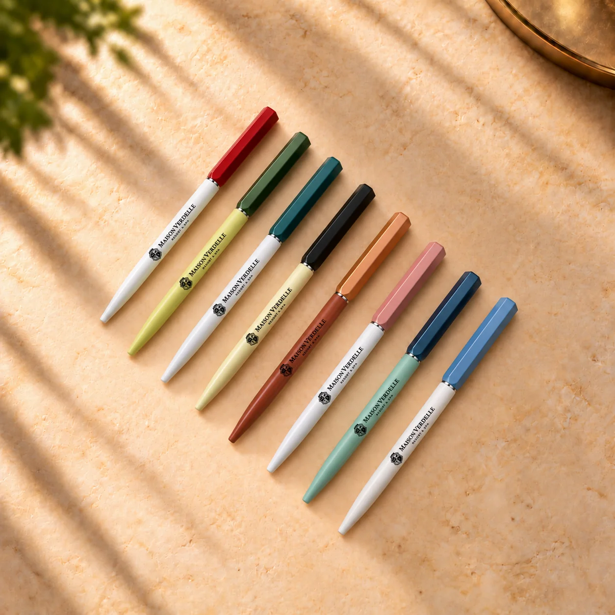 Eight branded hotel pens in assorted colours with a hotel logo
